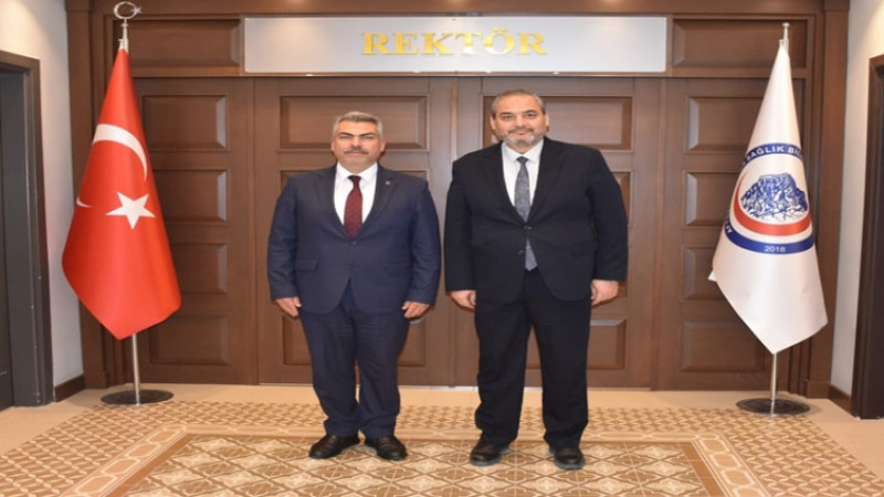 Uğur Ülgen, AFSÜ Rektörü Prof. Dr. Adem Aslan’ı ziyaret etti